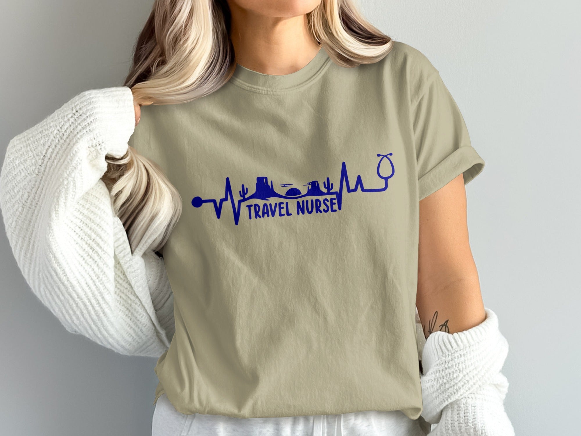T-shirt with blue heartbeat graphic, desert landscape, and "Travel Nurse" text.