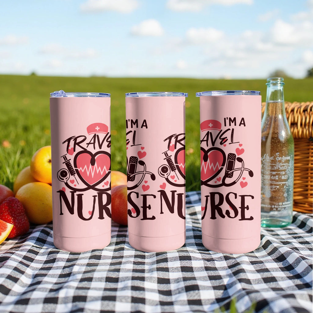 Three pink travel nurse tumblers with heart and stethoscope design on a picnic blanket.