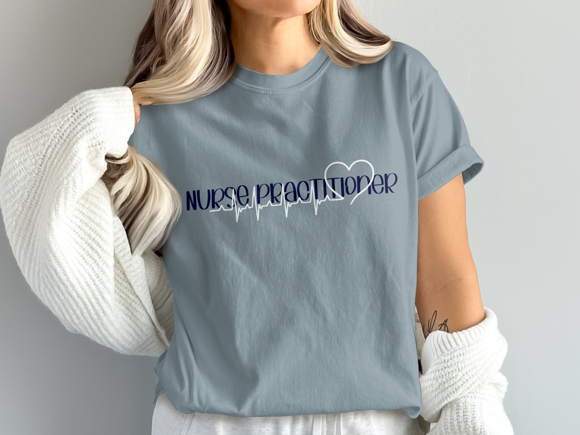 Blue t-shirt with "Nurse Practitioner" and a heart-shaped EKG line.