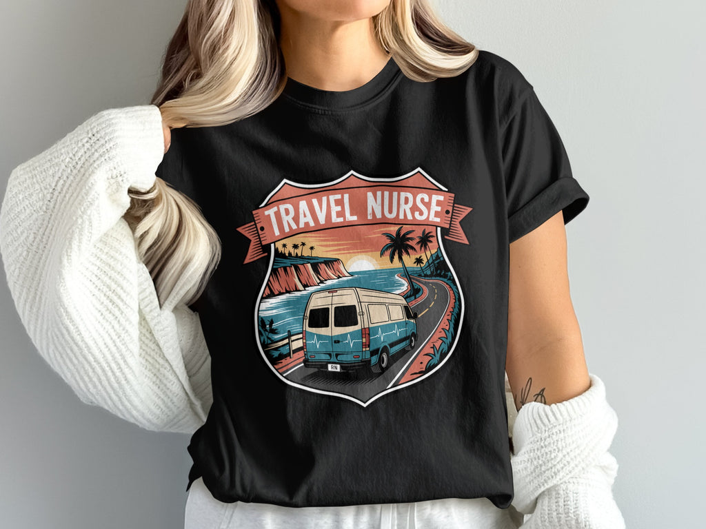Black t-shirt with travel nurse graphic of a van on a road with ocean and palm trees.