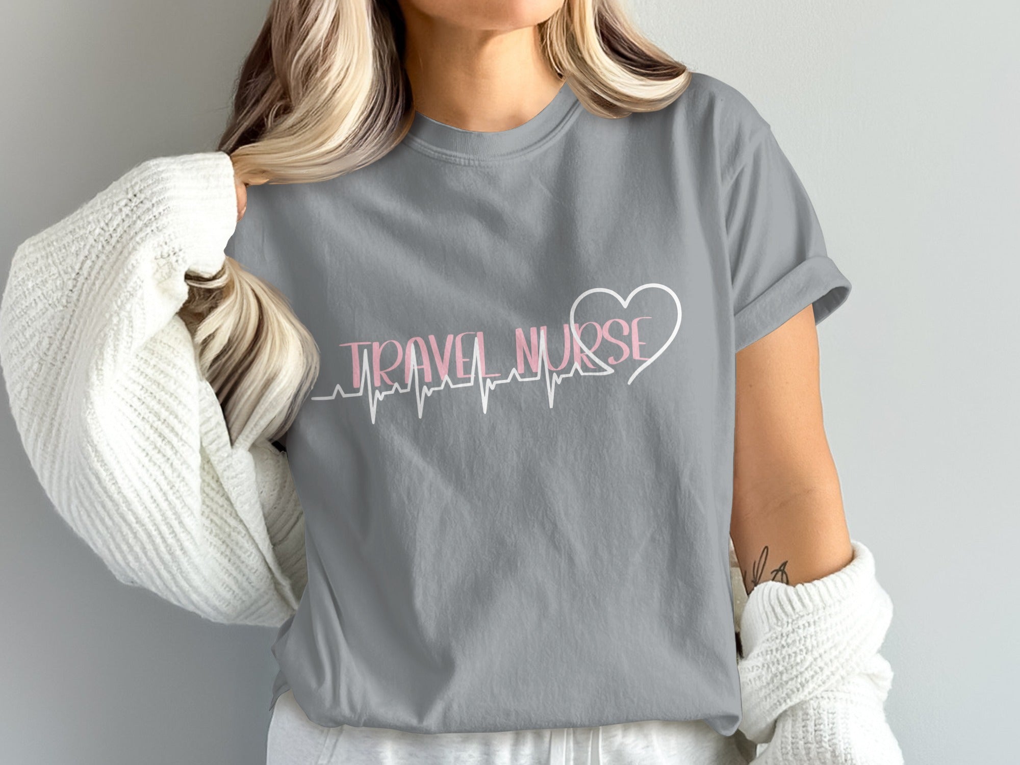 Grey t-shirt with "Travel Nurse" text and heartbeat line design.
