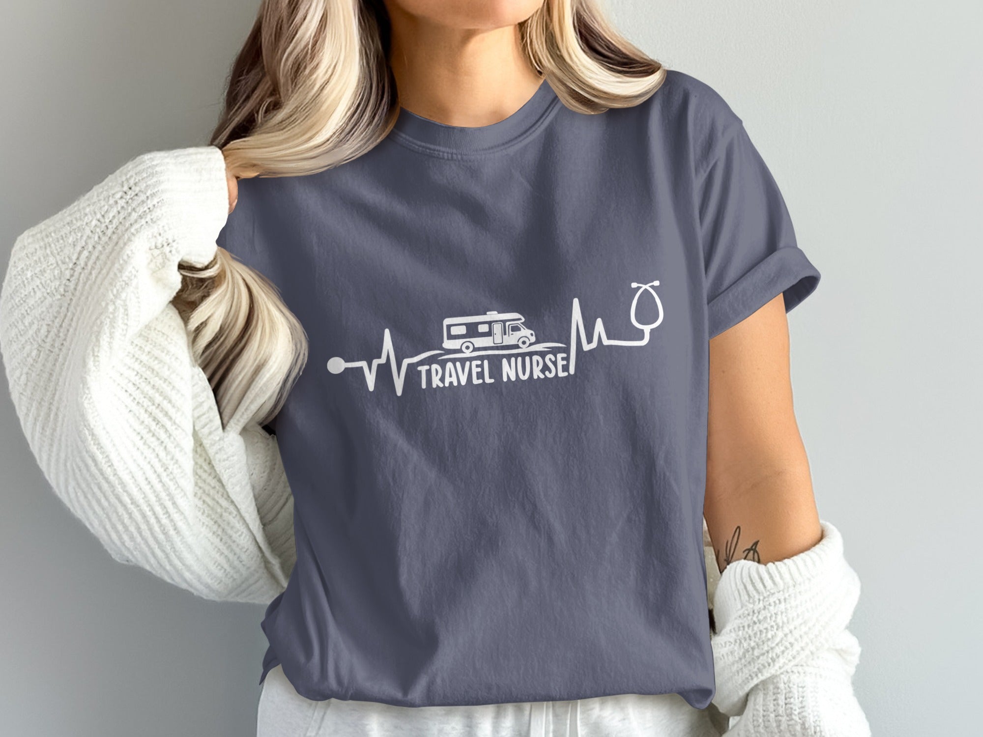 T-shirt with RV and stethoscope forming a heartbeat line, text "TRAVEL NURSE".