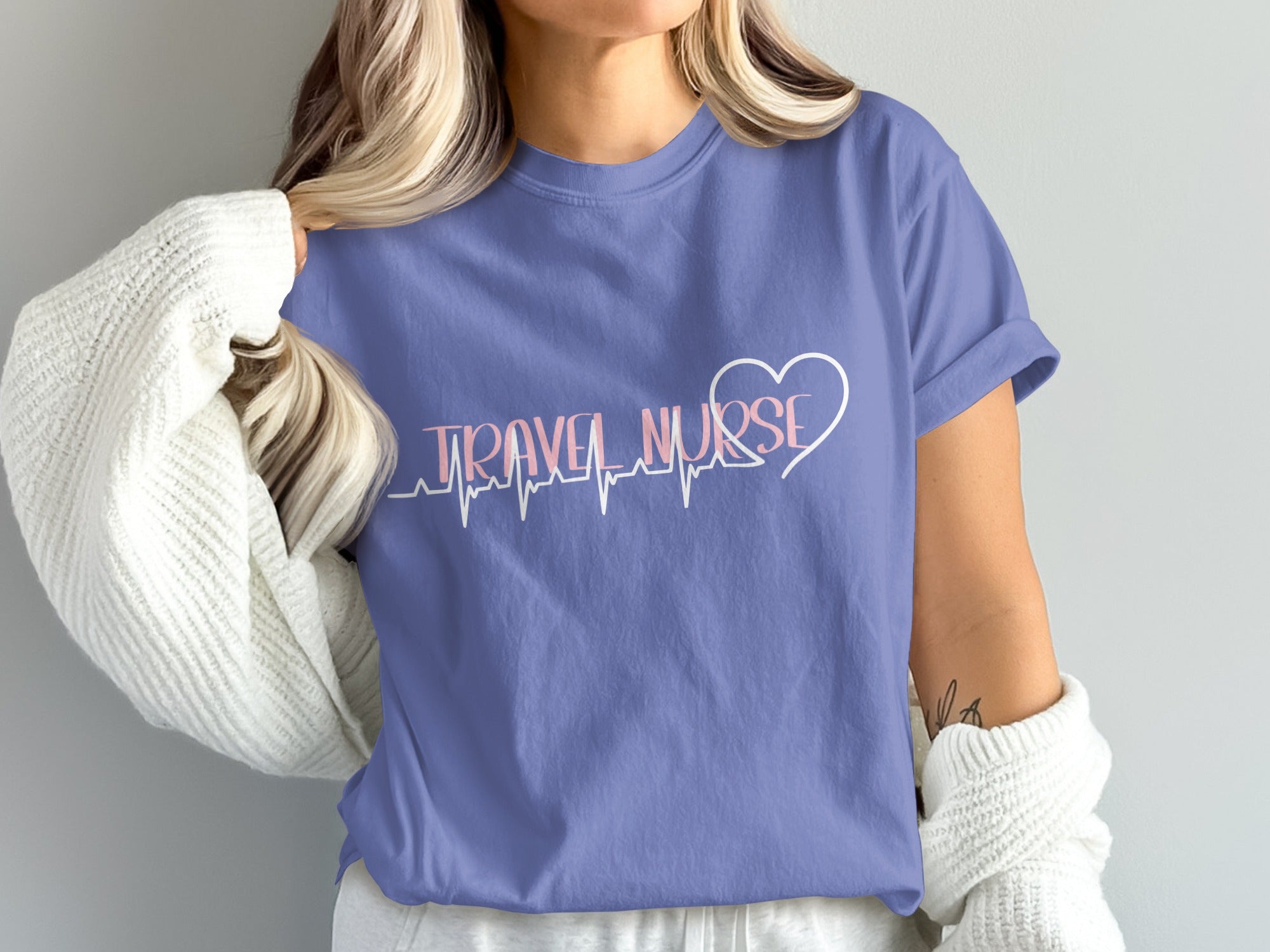 Purple t-shirt with "TRAVEL NURSE" text and heartbeat graphic.