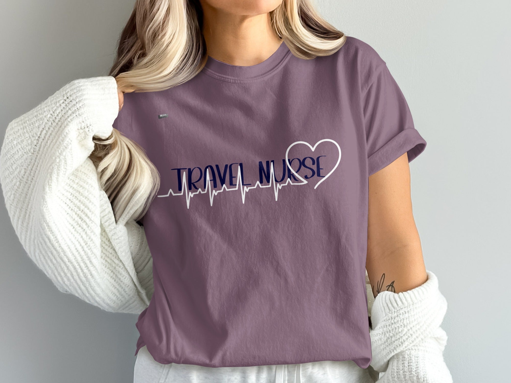 Purple t-shirt with "TRAVEL NURSE" and heart heartbeat design.