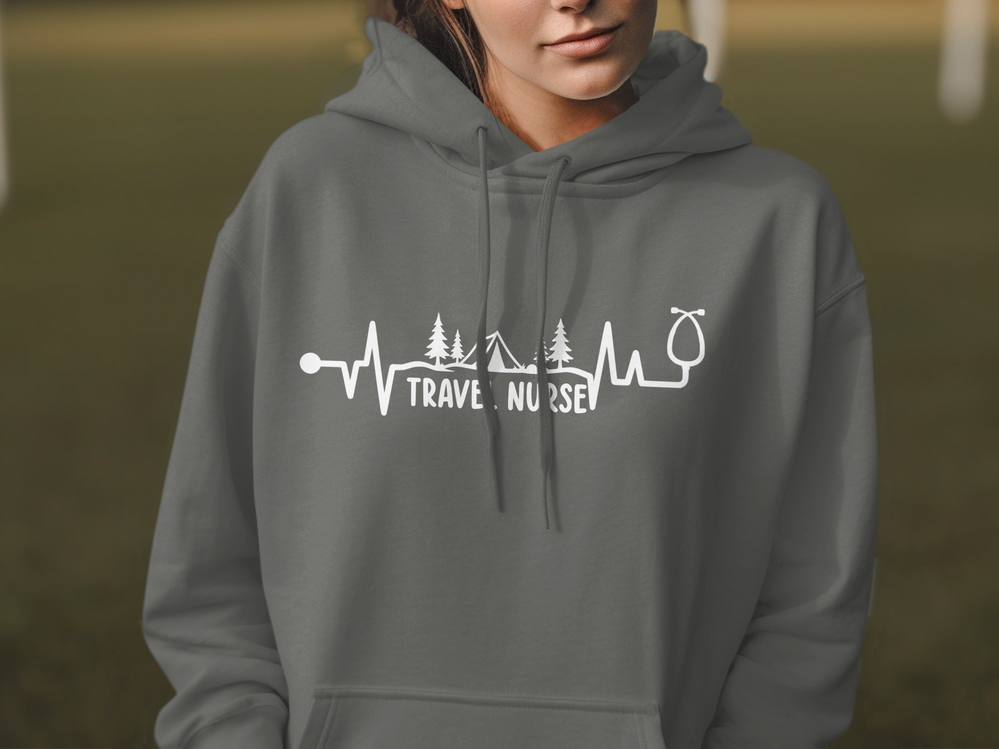 Grey hoodie with "Travel Nurse" text in a heartbeat EKG design.