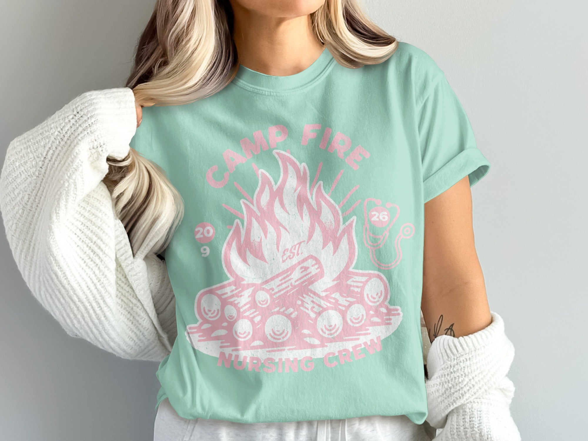 Mint t-shirt with pink campfire and nursing crew design.