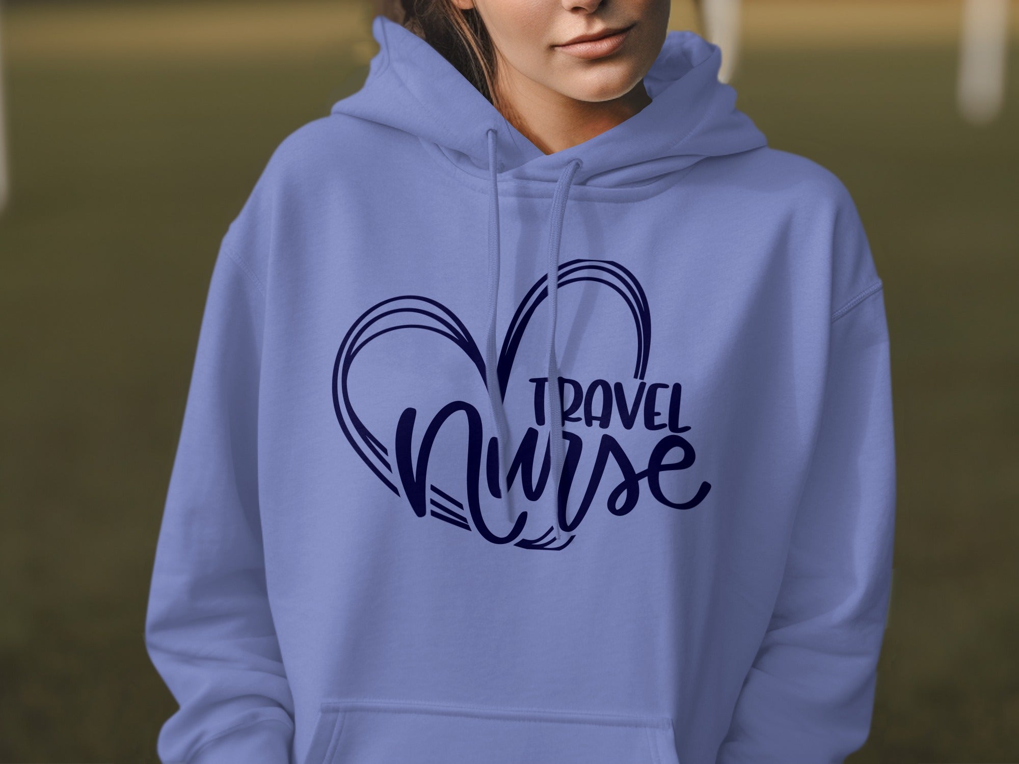 Light purple hoodie with navy blue "Travel Nurse" heart graphic on chest.