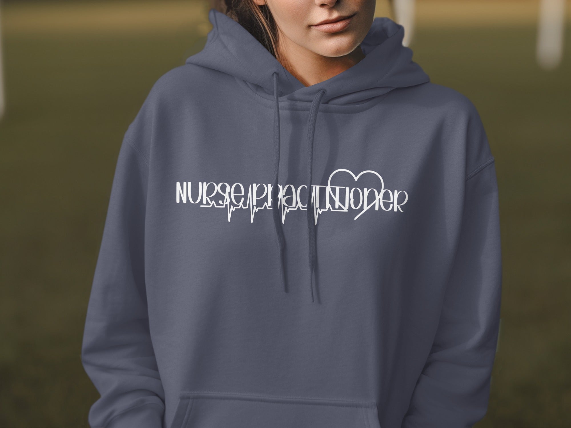 Dark blue hoodie with white "Nurse Practitioner" text and heart monitor graphic.