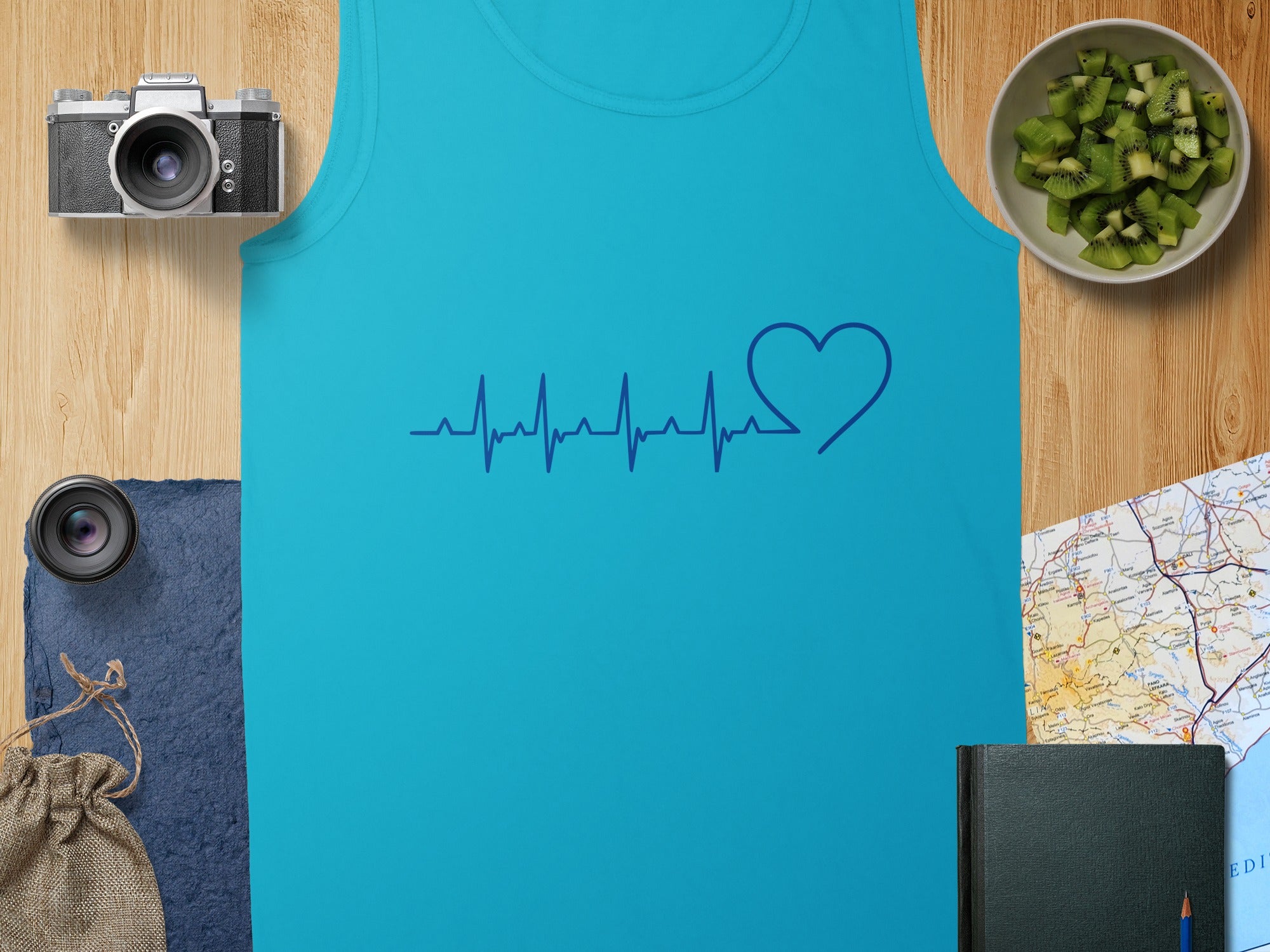 Blue tank top with a navy blue heartbeat graphic and a heart.