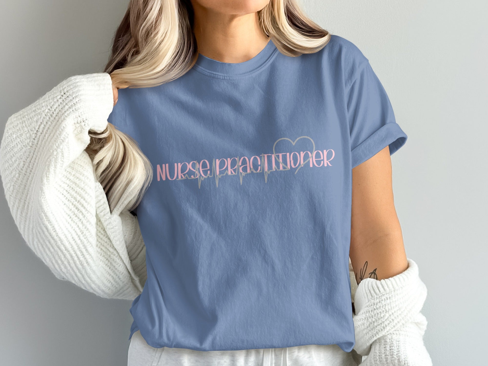 Blue t-shirt with "Nurse Practitioner" and a heartbeat line design.