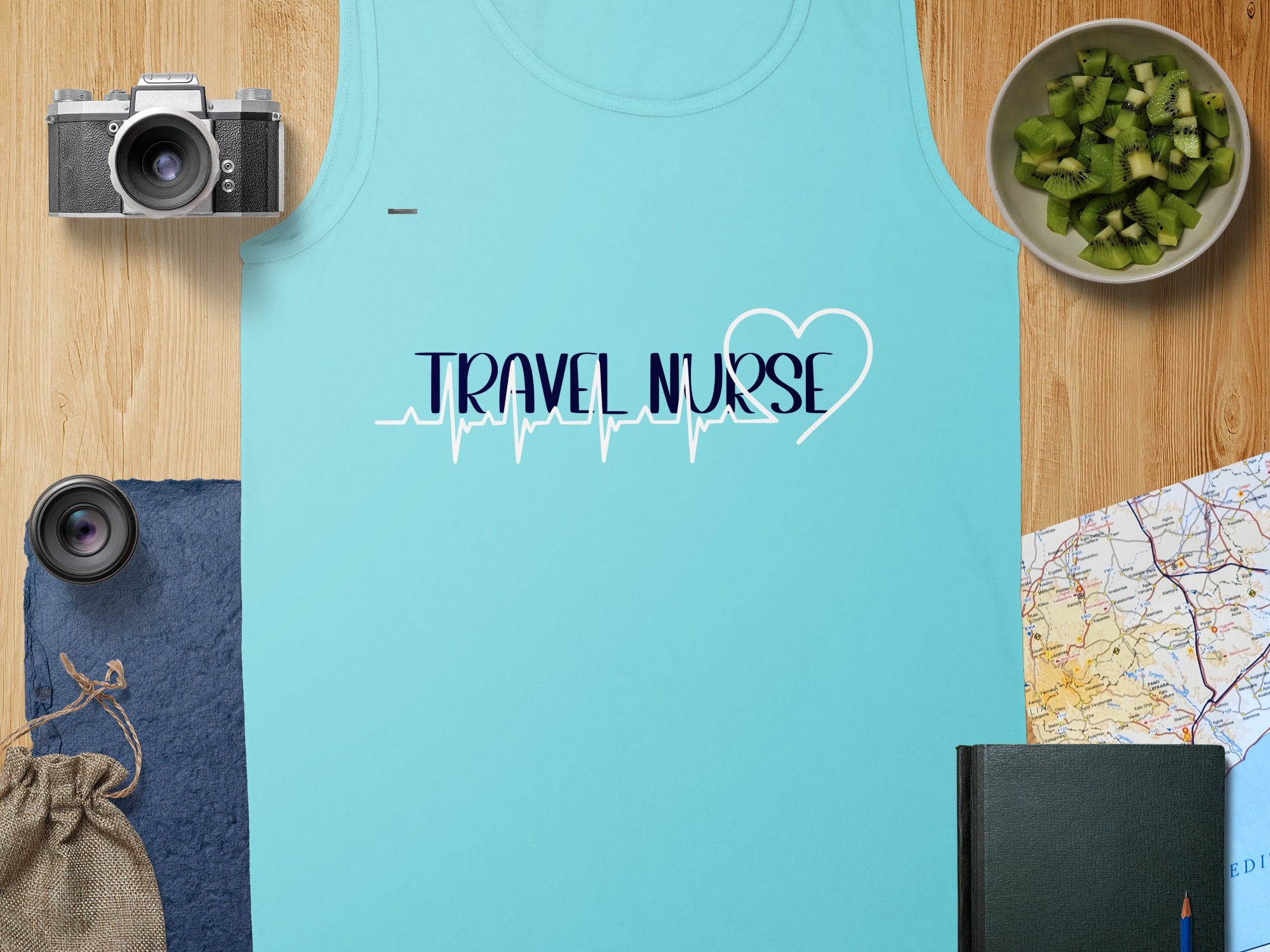 Light blue tank top with "TRAVEL NURSE" text and a heart EKG design.