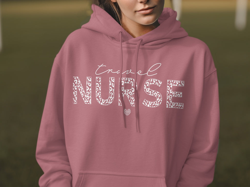 Pink hoodie with "Travel Nurse" text and a leopard print heart.