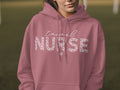 Pink hoodie with "Travel Nurse" text and a leopard print heart.