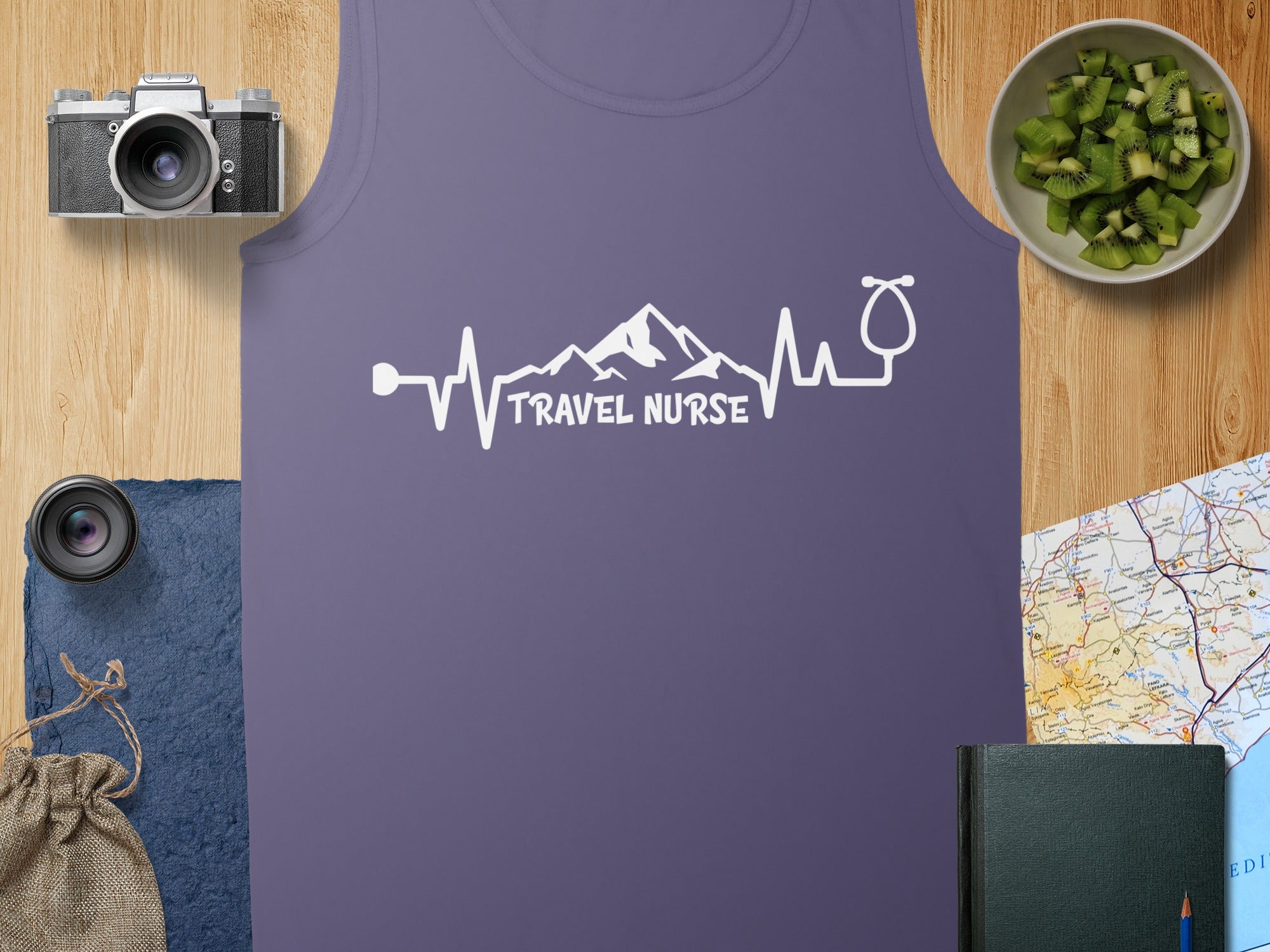 Purple tank top with "Travel Nurse" electrocardiogram and stethoscope design.