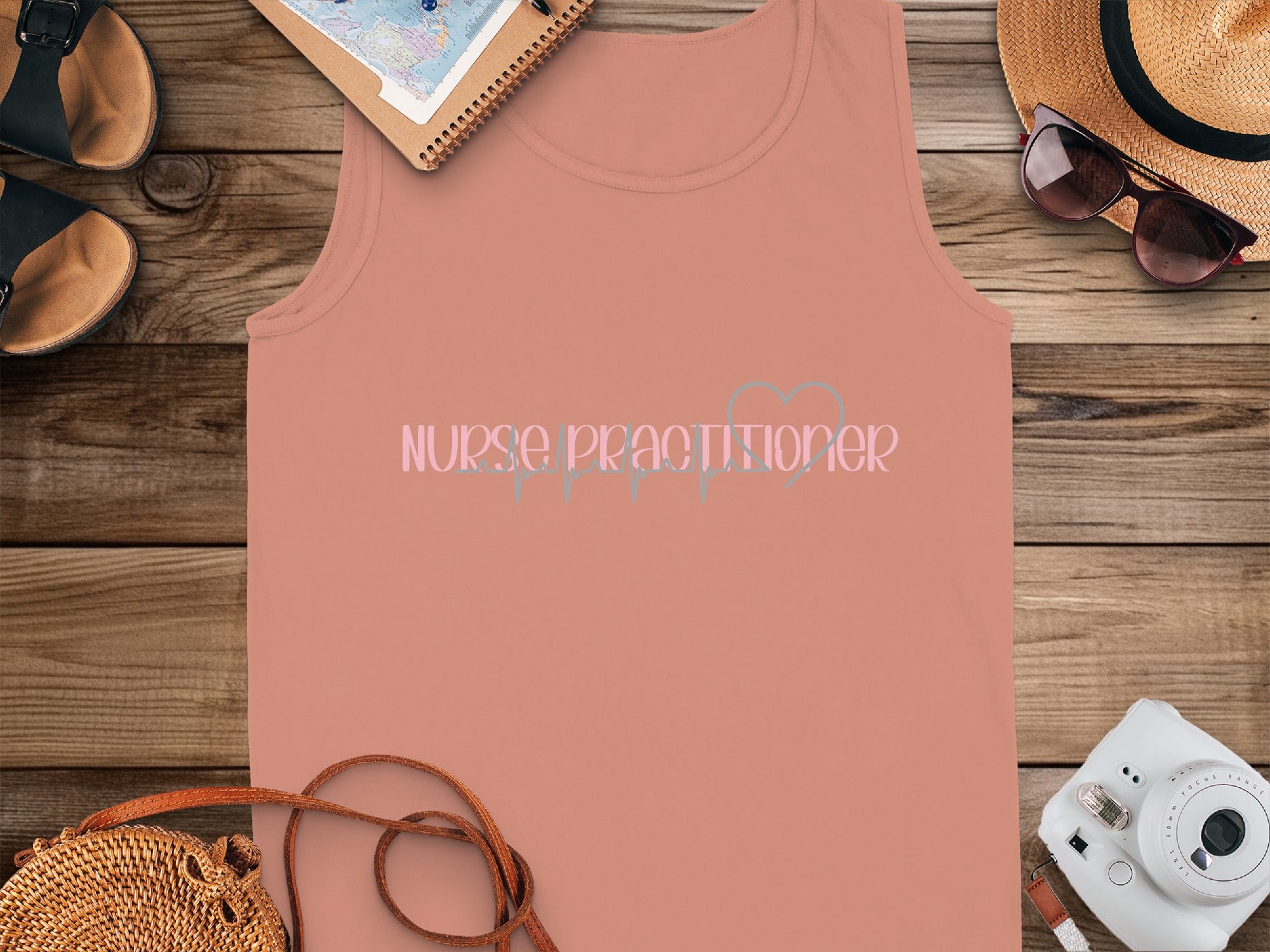 Pink tank top with "Nurse Practitioner" text and heart stethoscope graphic.