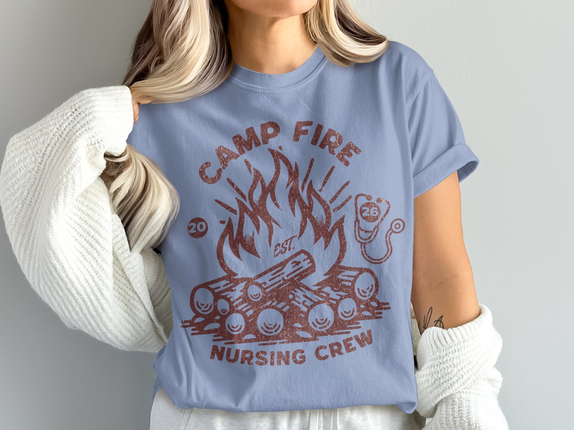 Blue t-shirt with "Camp Fire Nursing Crew" and campfire graphic.
