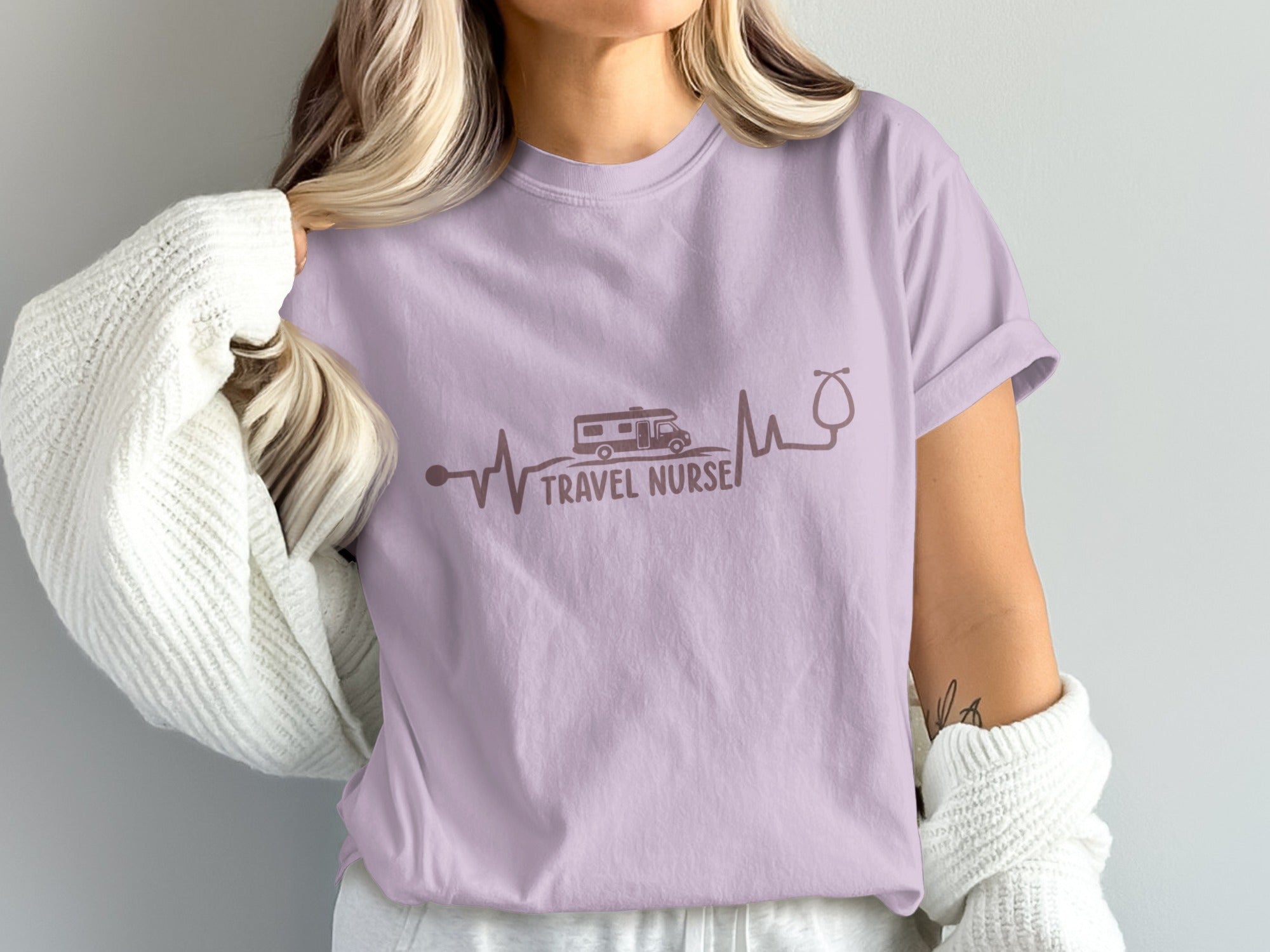 Purple t-shirt with "TRAVEL NURSE" text and RV heartbeat graphic.