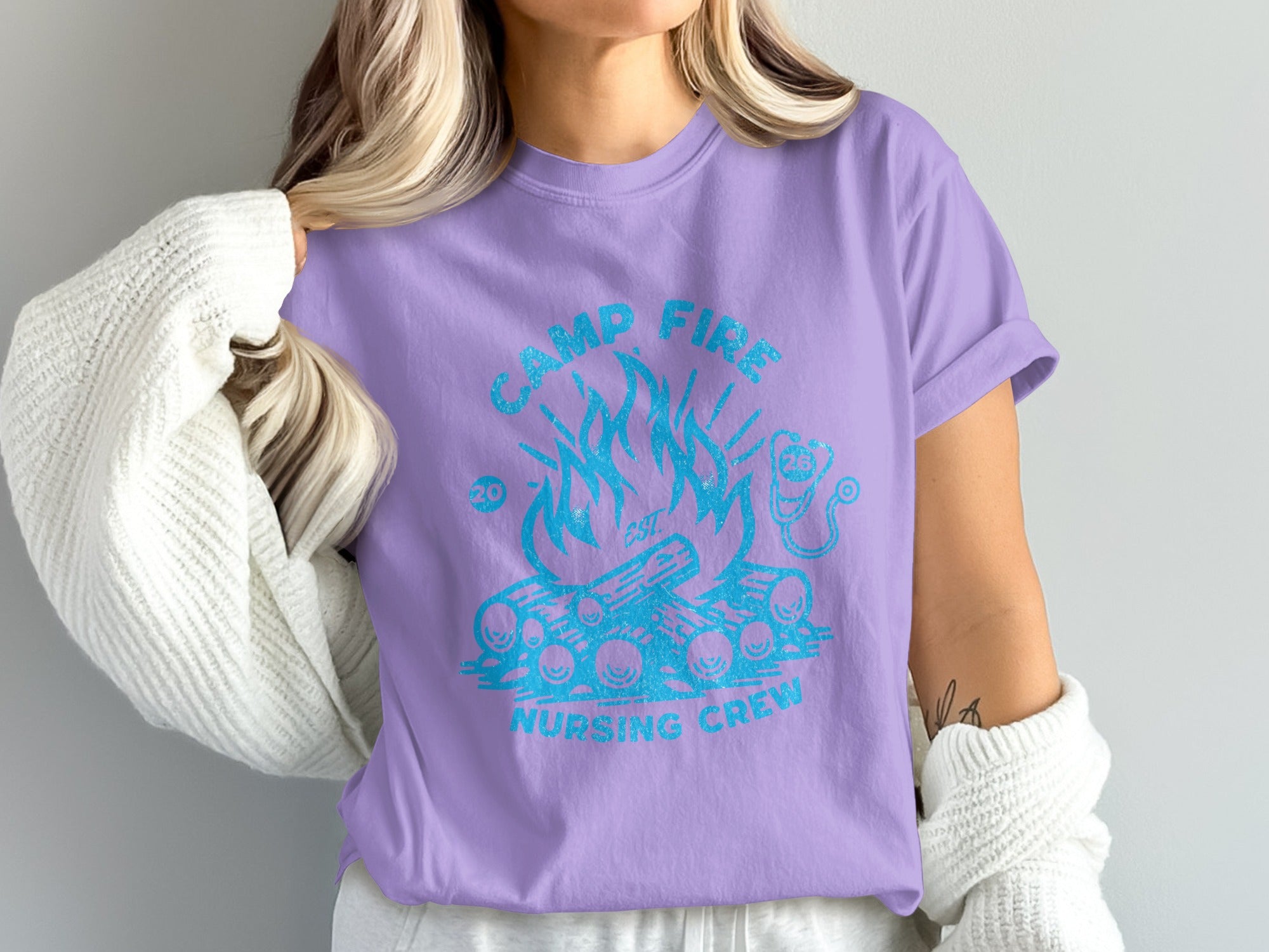 Purple t-shirt with "Camp Fire Nursing Crew" and campfire graphic.
