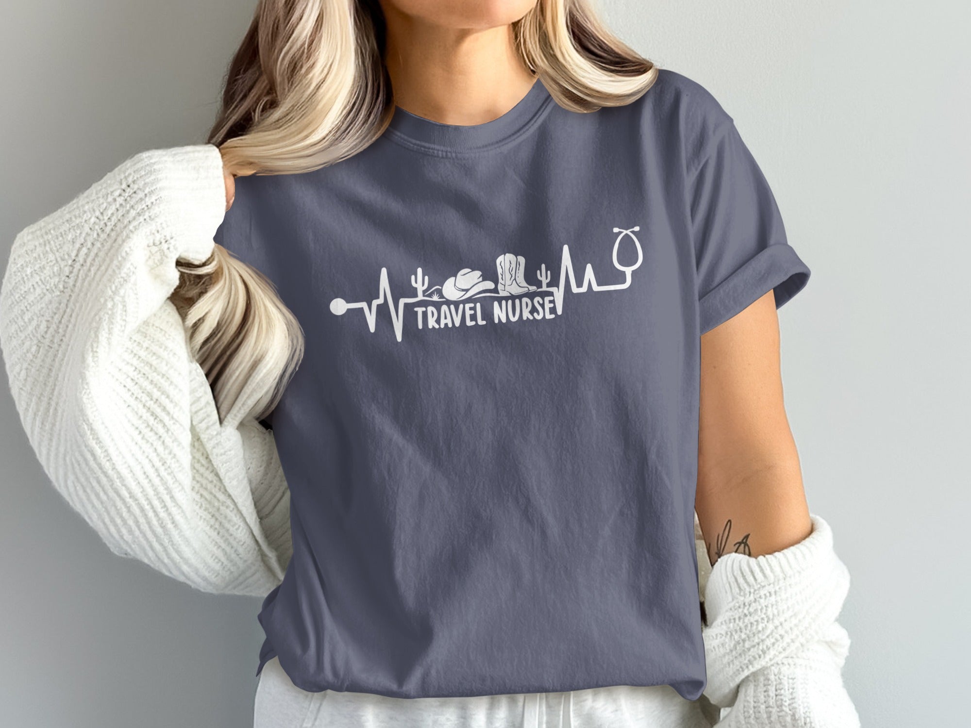 T-shirt with "Travel Nurse" text and stethoscope, cactus, and cowboy boot graphic.