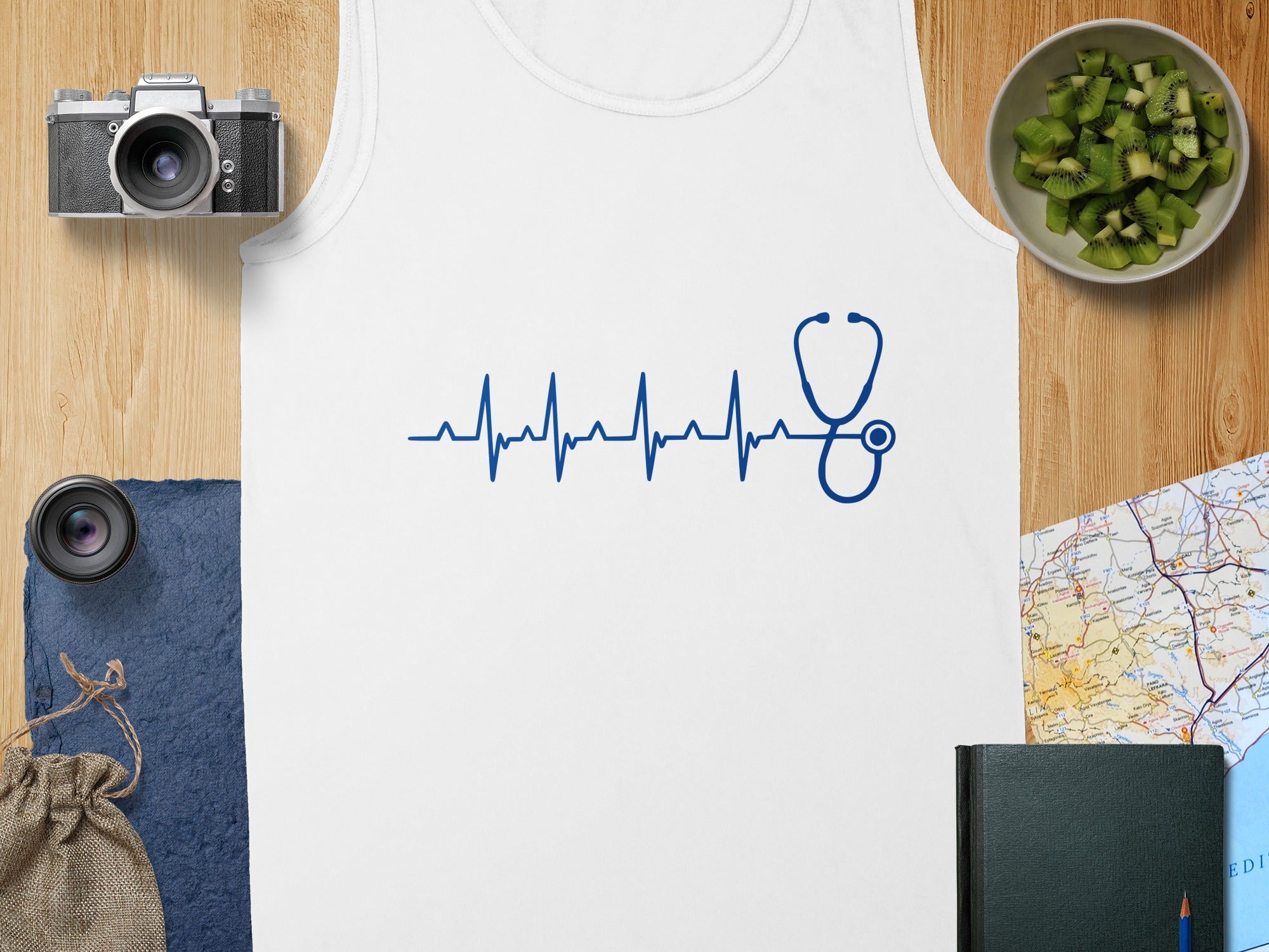 White tank top with blue heartbeat graphic and stethoscope.