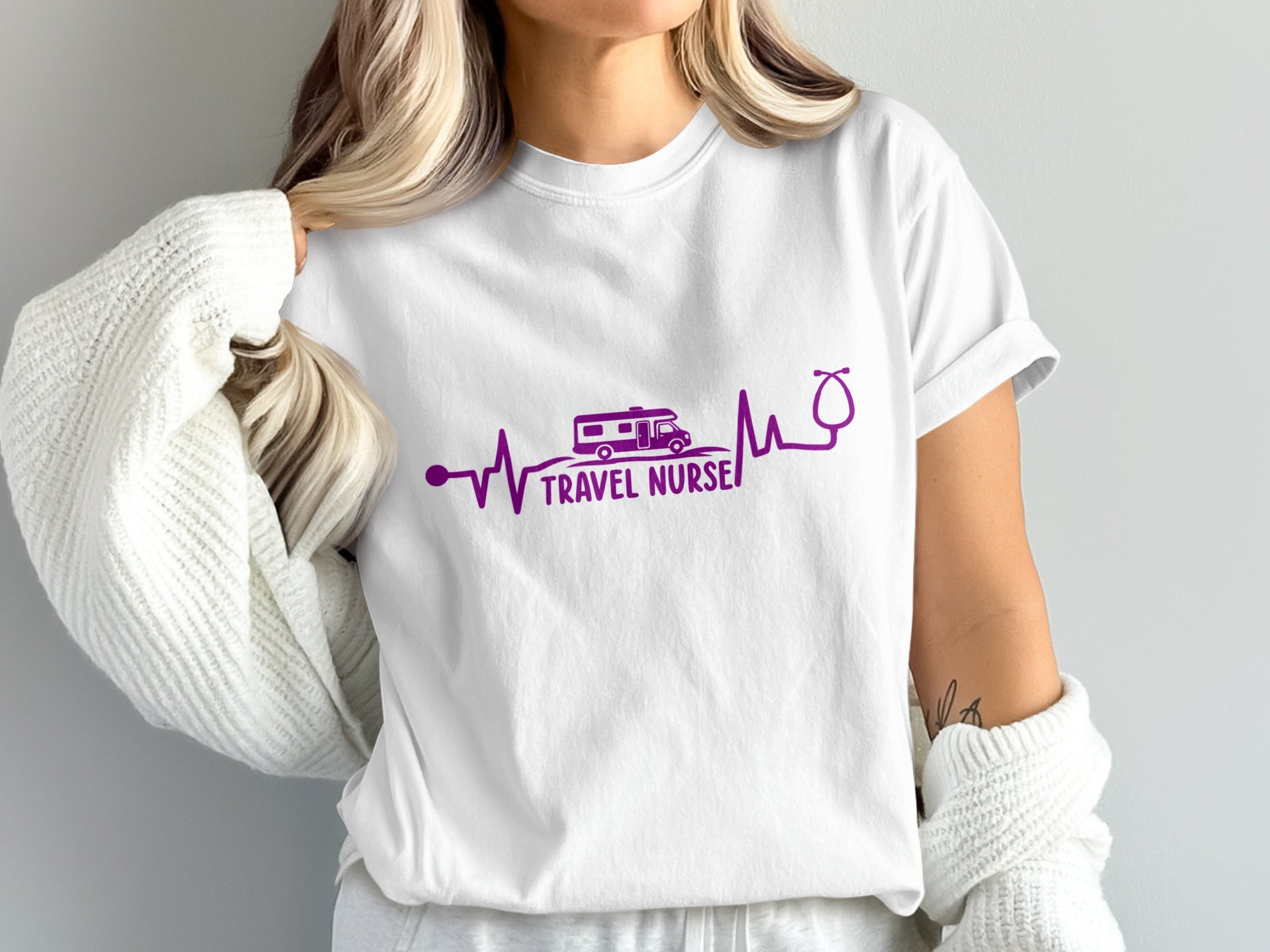 White t-shirt with purple stethoscope and RV design, reading "Travel Nurse".