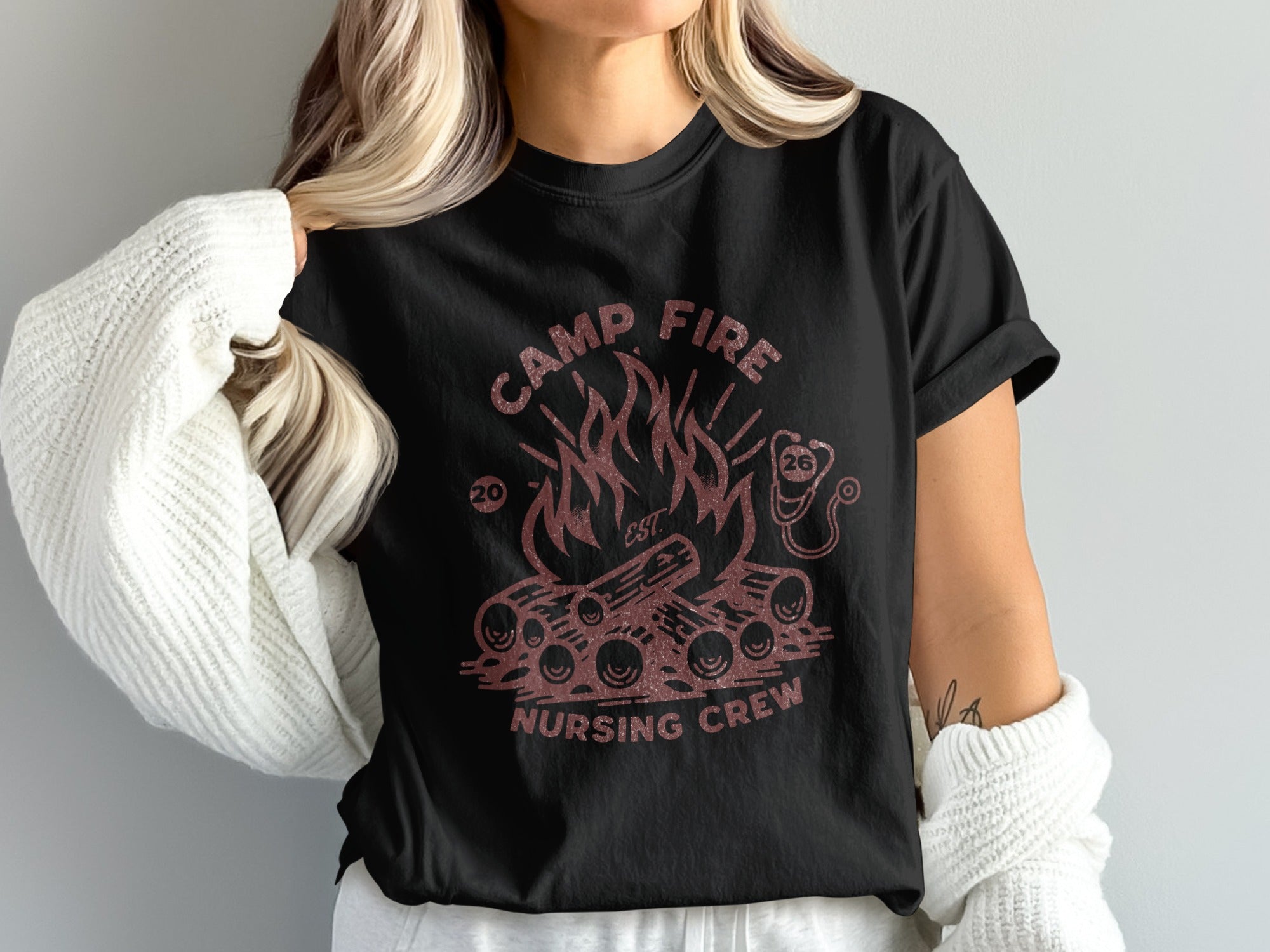 Black t-shirt with campfire graphic and "Camp Fire Nursing Crew" text.