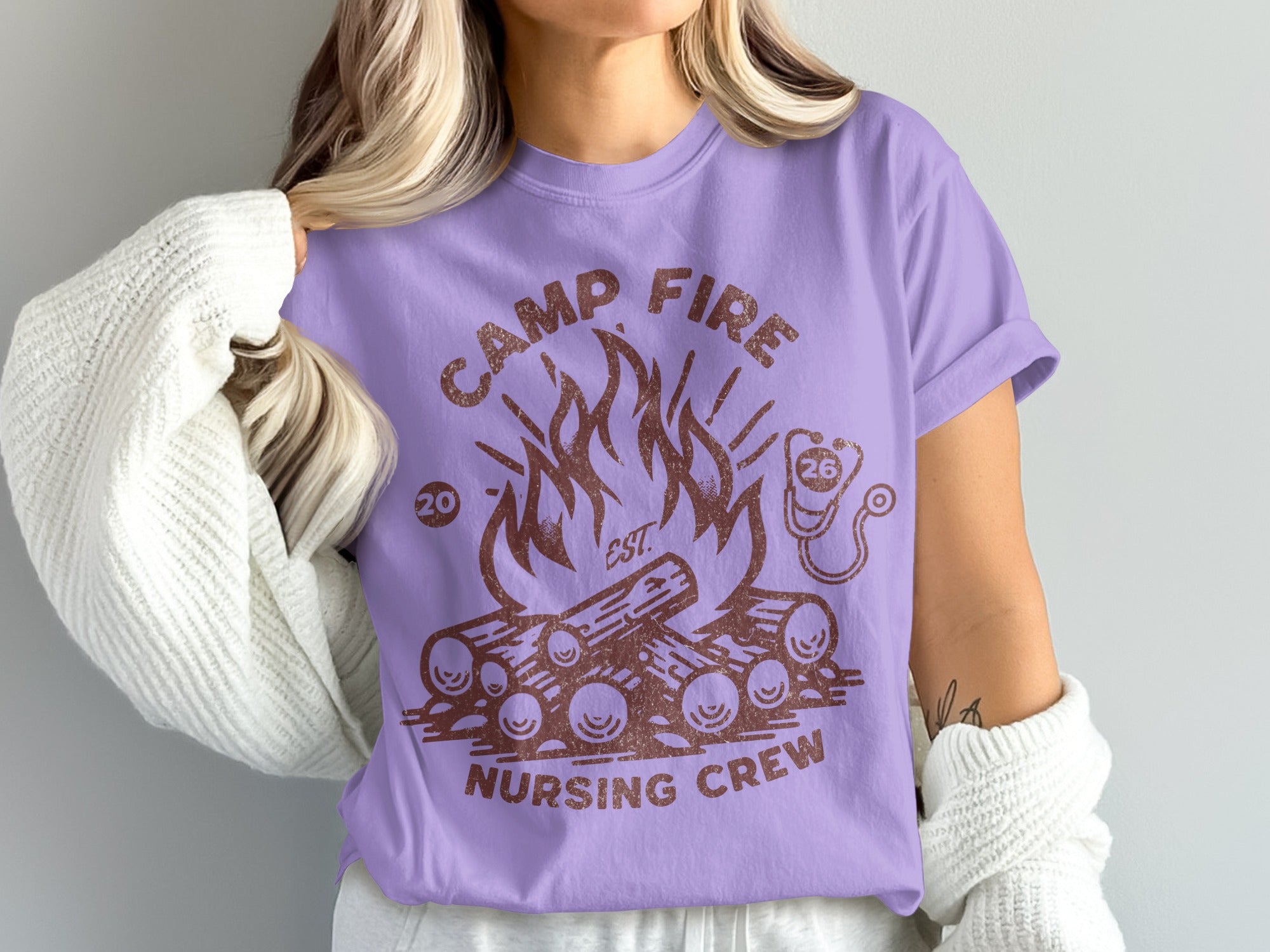 Lavender t-shirt with "Camp Fire Nursing Crew" and campfire graphic.