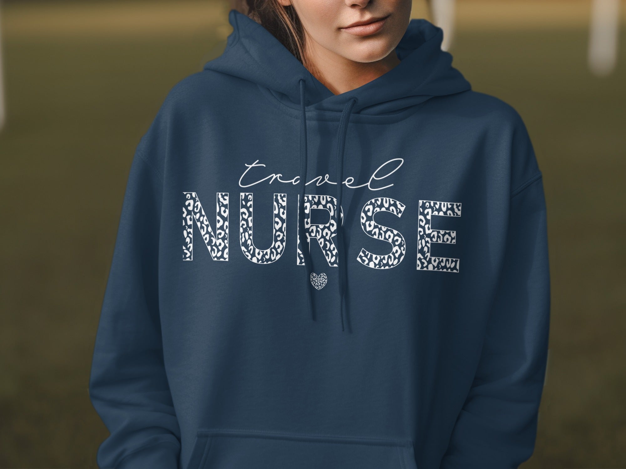 Navy blue hoodie with white leopard print "TRAVEL NURSE" text and heart.