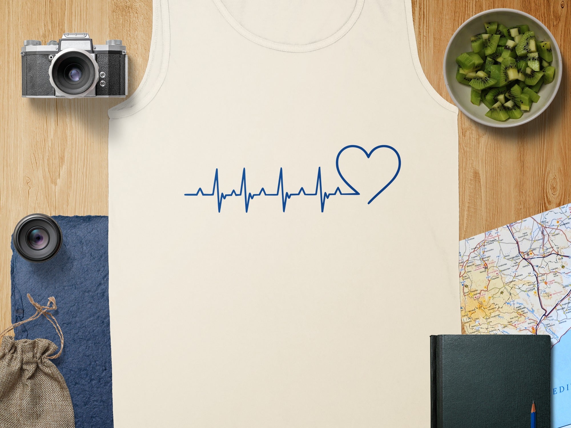 Cream tank top with blue heart and EKG line graphic.