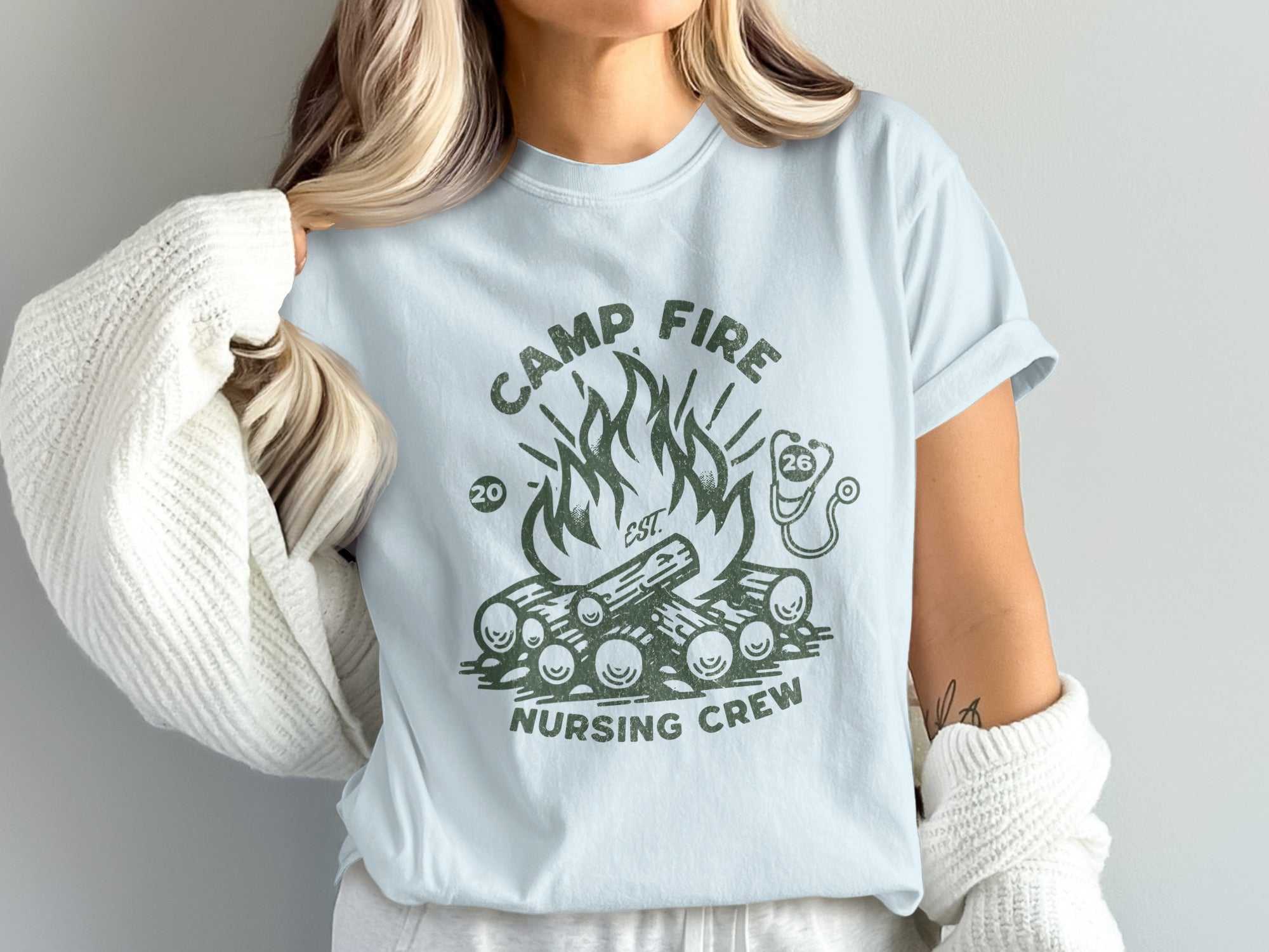 Light blue t-shirt with "Camp Fire Nursing Crew" and campfire graphic.