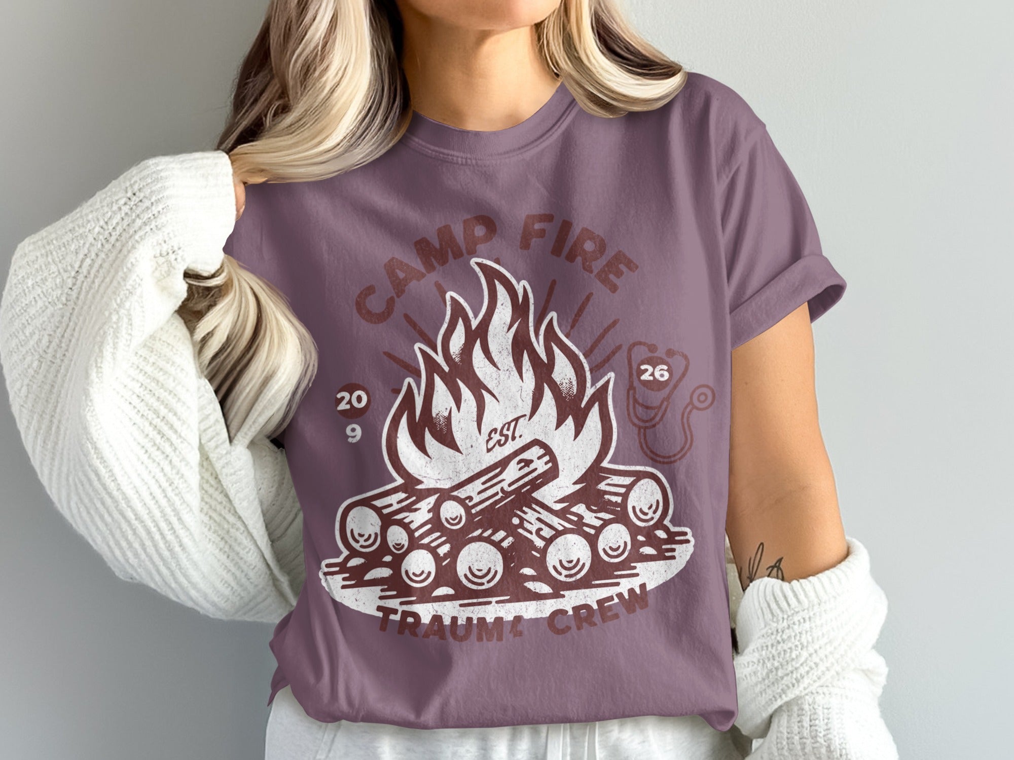 Camp Fire Trauma Crew t-shirt with logs and flames.