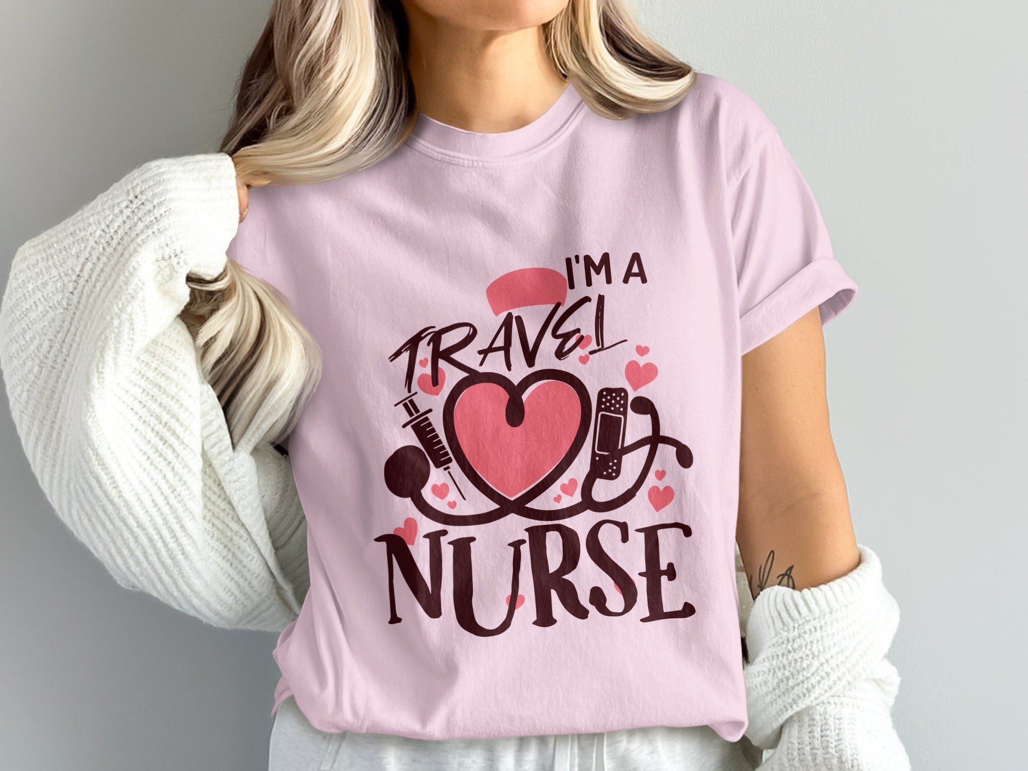 I'm a travel nurse text with stethoscope, heart, and syringe graphic.