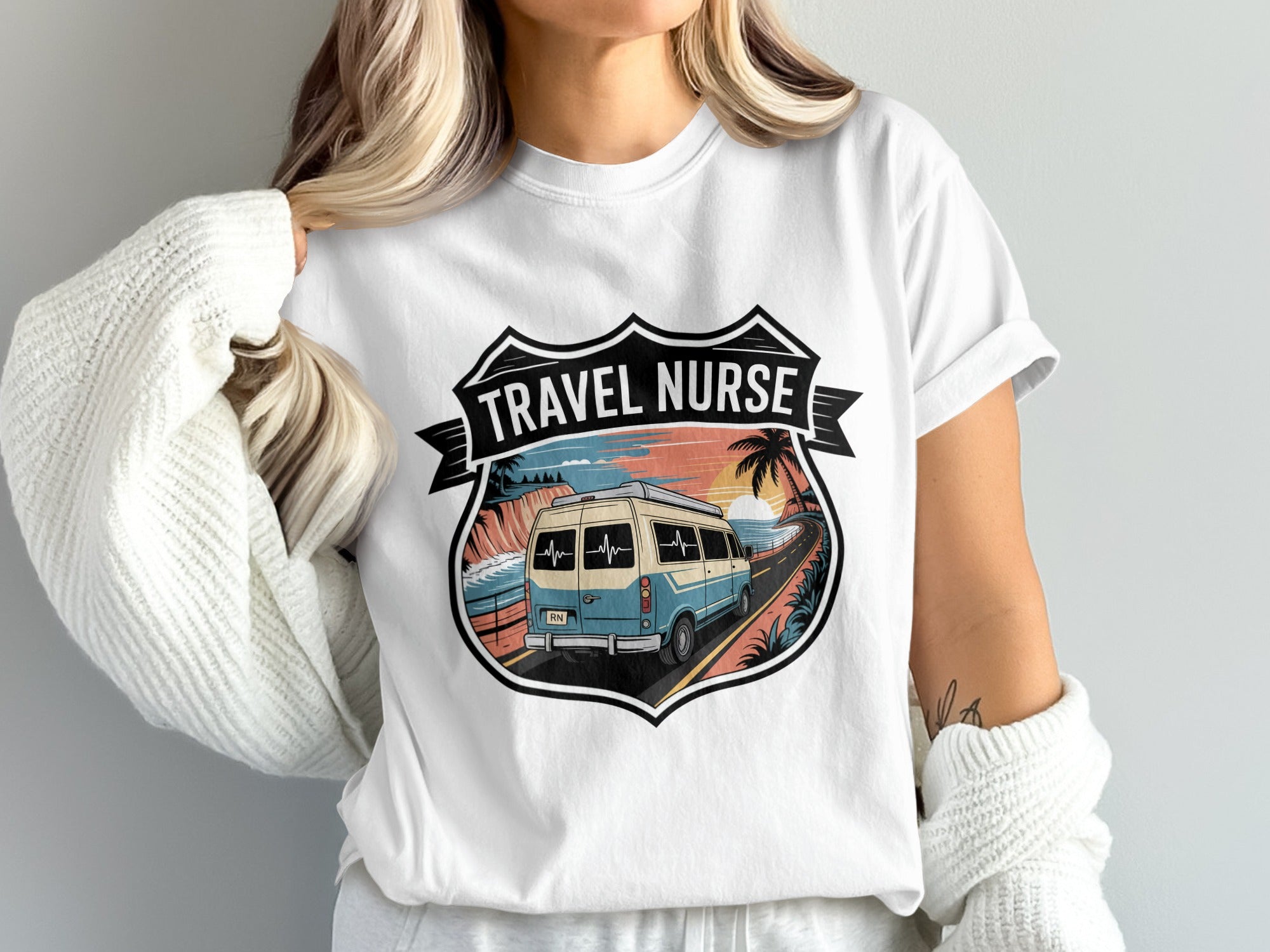 White t-shirt with "Travel Nurse" text over van on coastal road graphic.