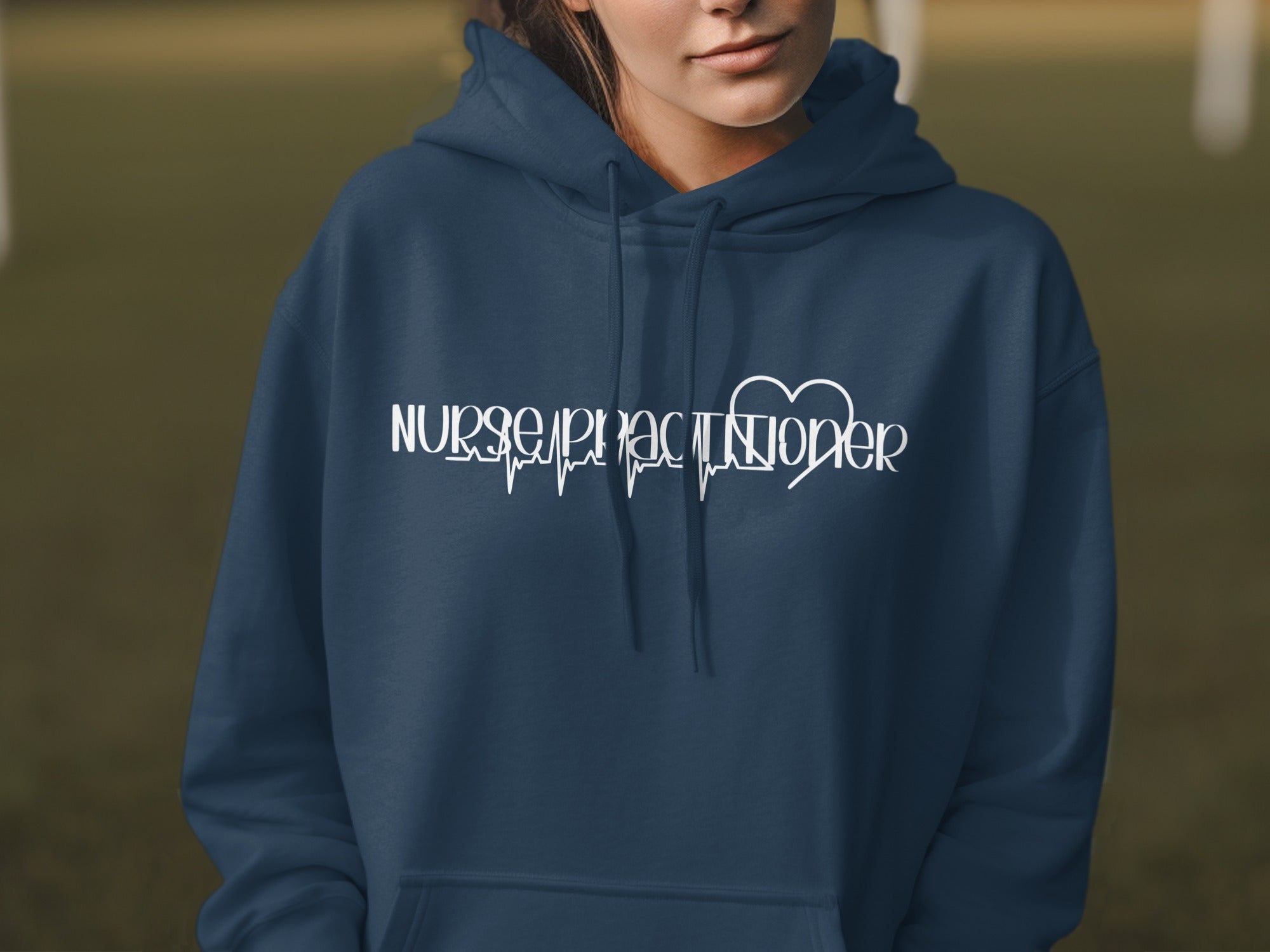 Navy hoodie with white "Nurse Practitioner" text and a heart rhythm graphic.
