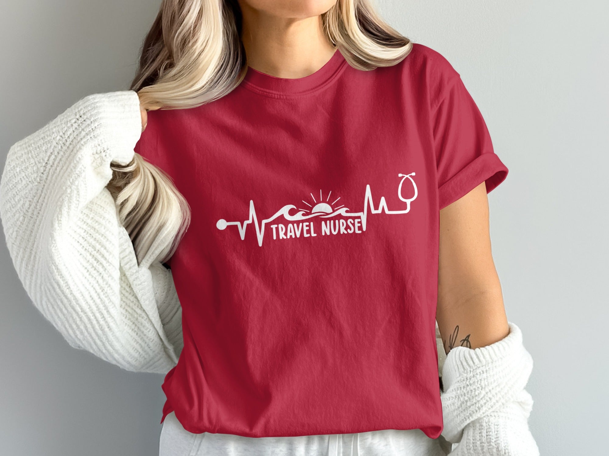 Red t-shirt with "TRAVEL NURSE" and a stethoscope-wave-sun graphic.
