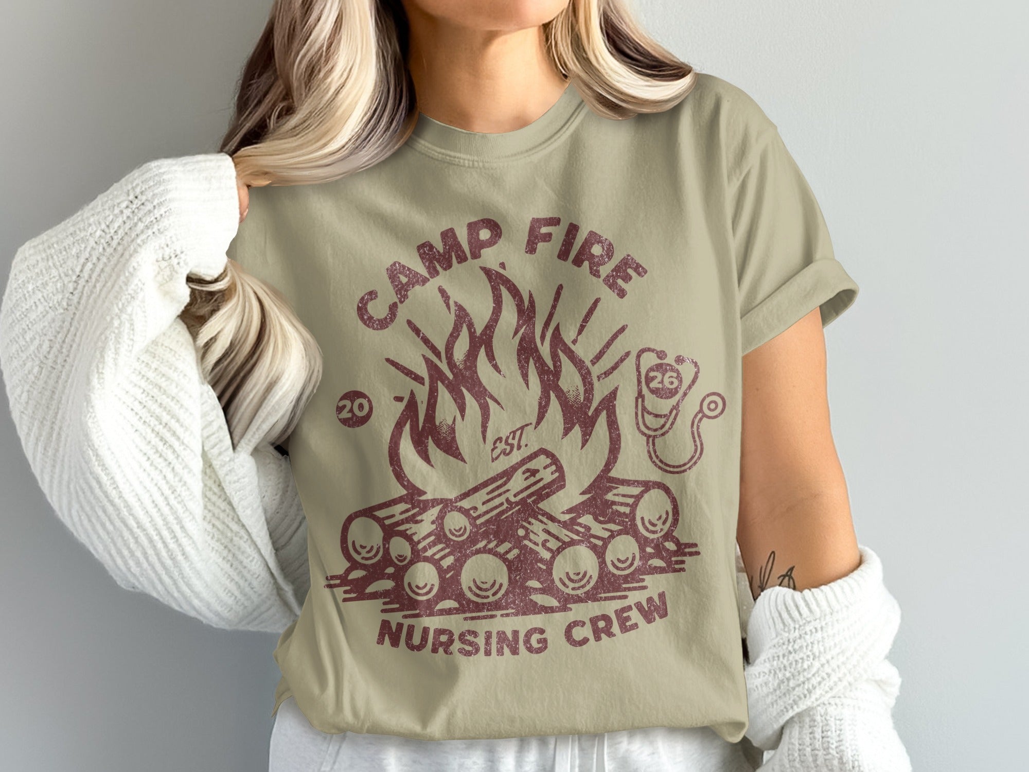 T-shirt with campfire and "Camp Fire Nursing Crew" text.