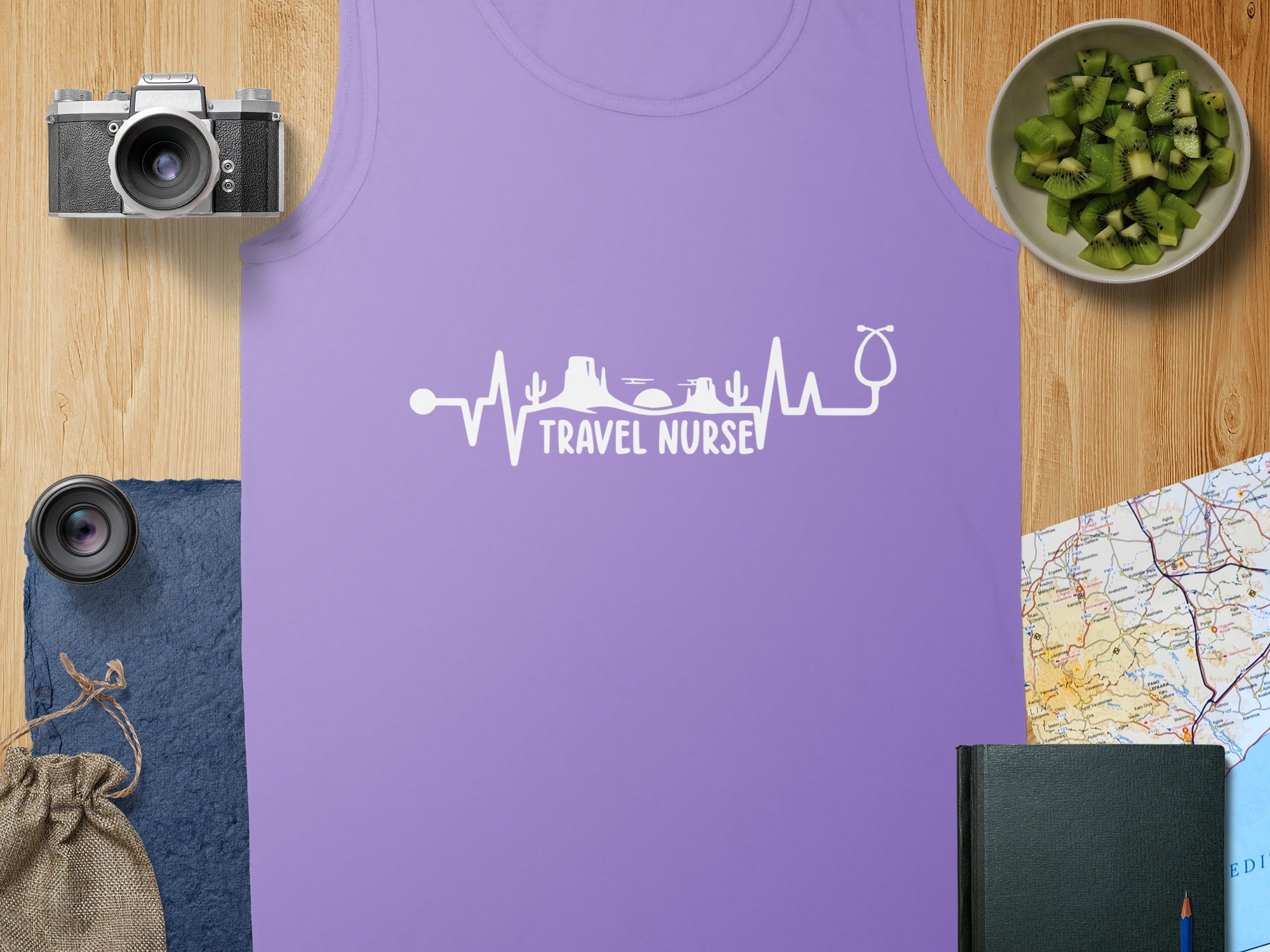 Purple tank top with "Travel Nurse" heartbeat and stethoscope graphic.