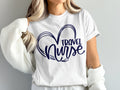 White t-shirt with navy blue "Travel Nurse" heart graphic.