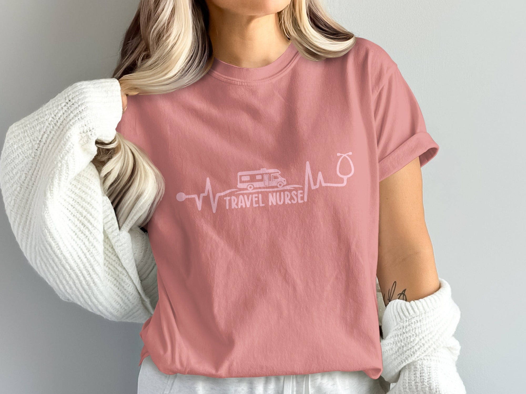 Pink t-shirt with "Travel Nurse" text and RV and stethoscope heartbeat graphic.