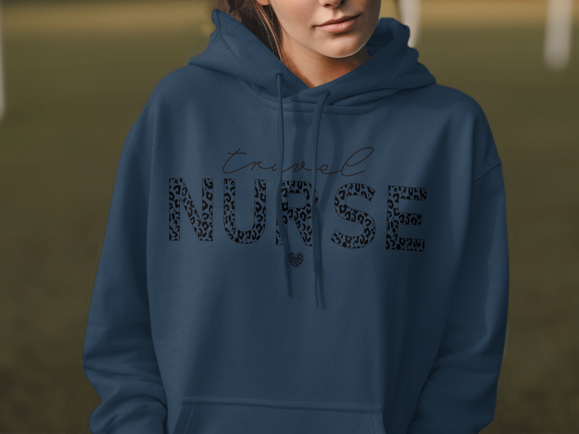 Navy blue hoodie with "travel NURSE" text in leopard print.