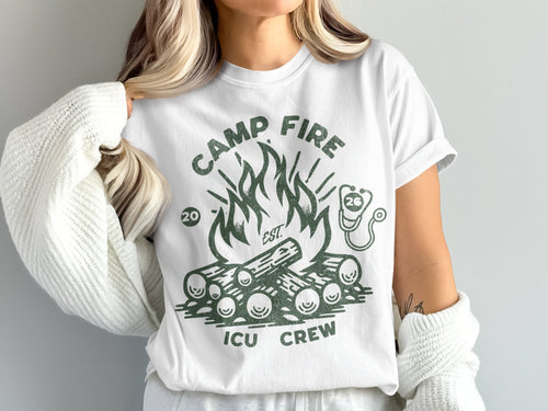 White t-shirt with green "Camp Fire ICU Crew" text and campfire graphic.