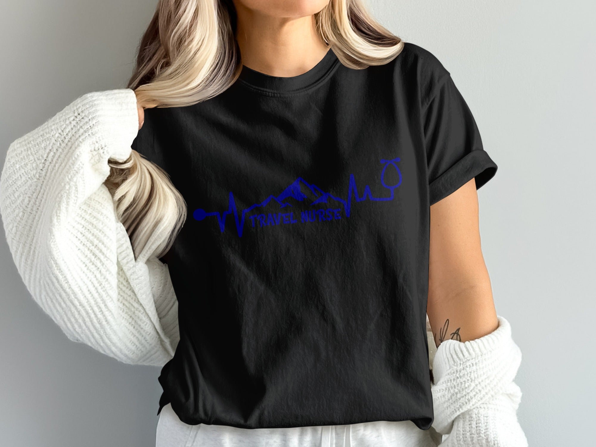 Black t-shirt with "TRAVEL NURSE" and blue mountain/stethoscope graphic.
