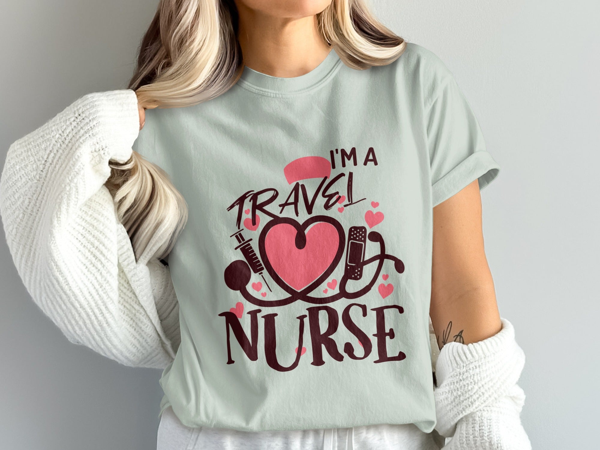 I'm a Travel Nurse text with heart, stethoscope, and syringe design.