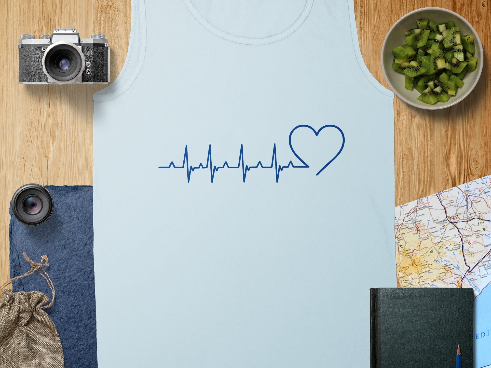 Light blue tank top with blue heart-shaped electrocardiogram graphic.