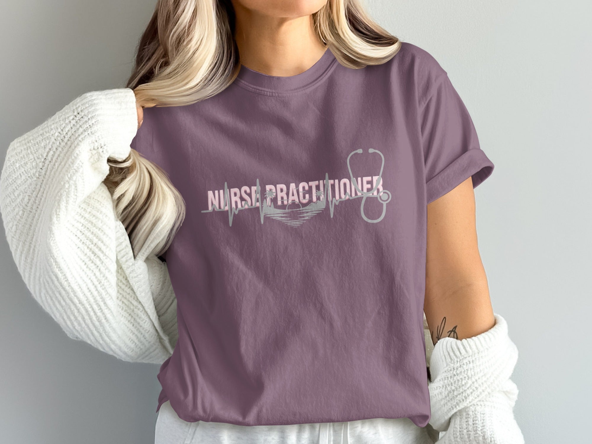 Nurse Practitioner t-shirt with stethoscope and heartbeat graphic.