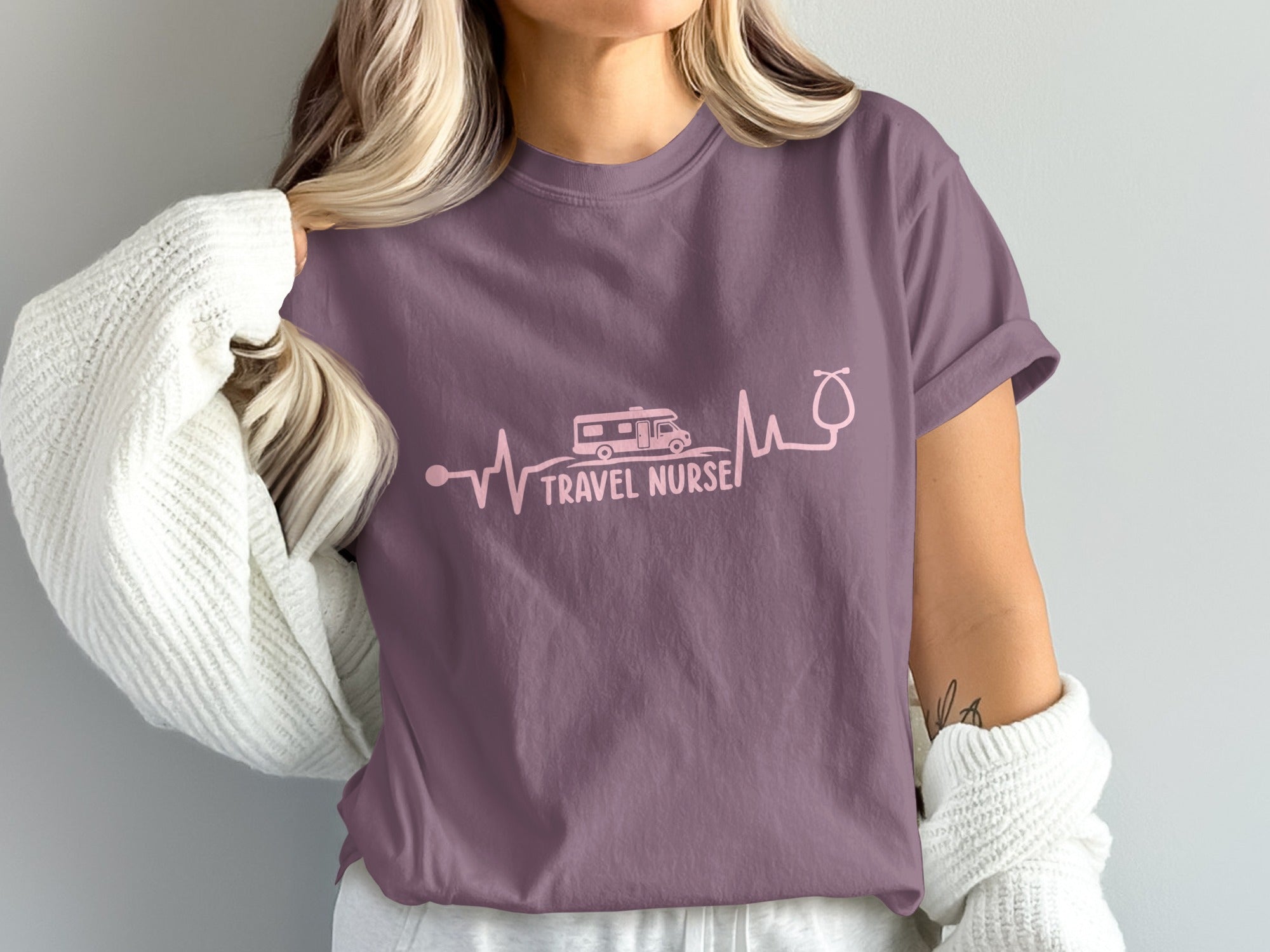 Purple t-shirt with "TRAVEL NURSE" and a heartbeat graphic.