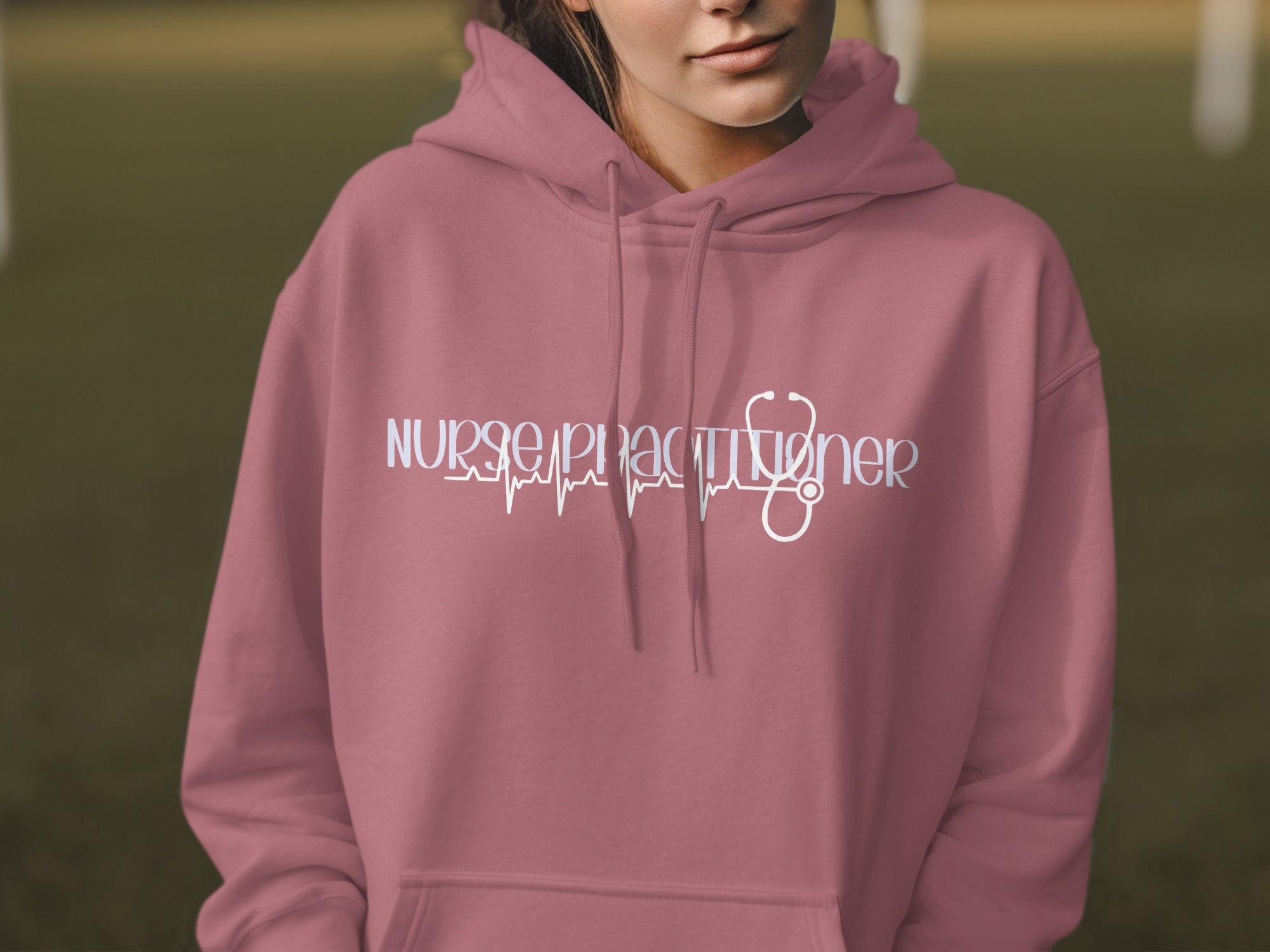 Nurse practitioner hoodie with a stethoscope and heart monitor graphic.