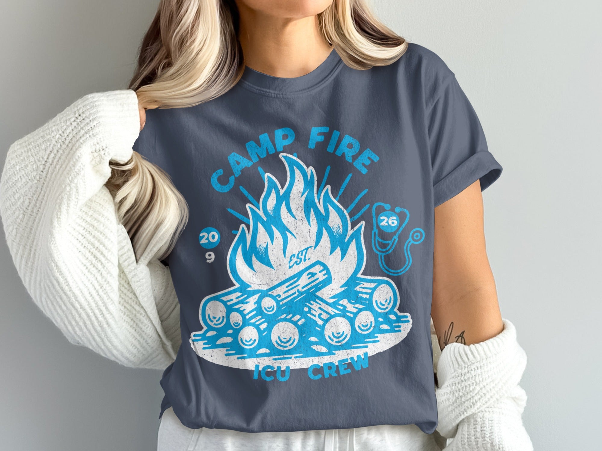Camp Fire ICU Crew t-shirt with a campfire and stethoscope graphic.
