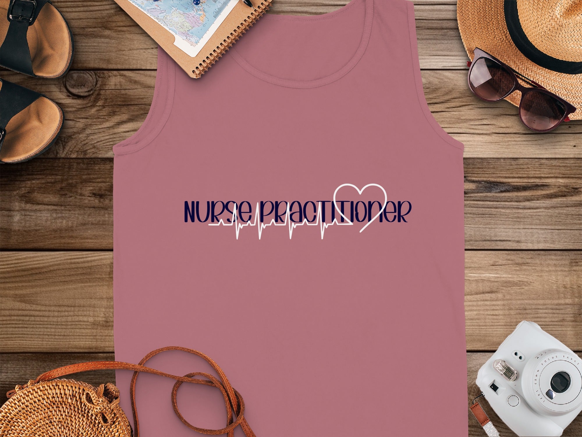 Dark pink tank top with "Nurse Practitioner" and heart rate line graphic.