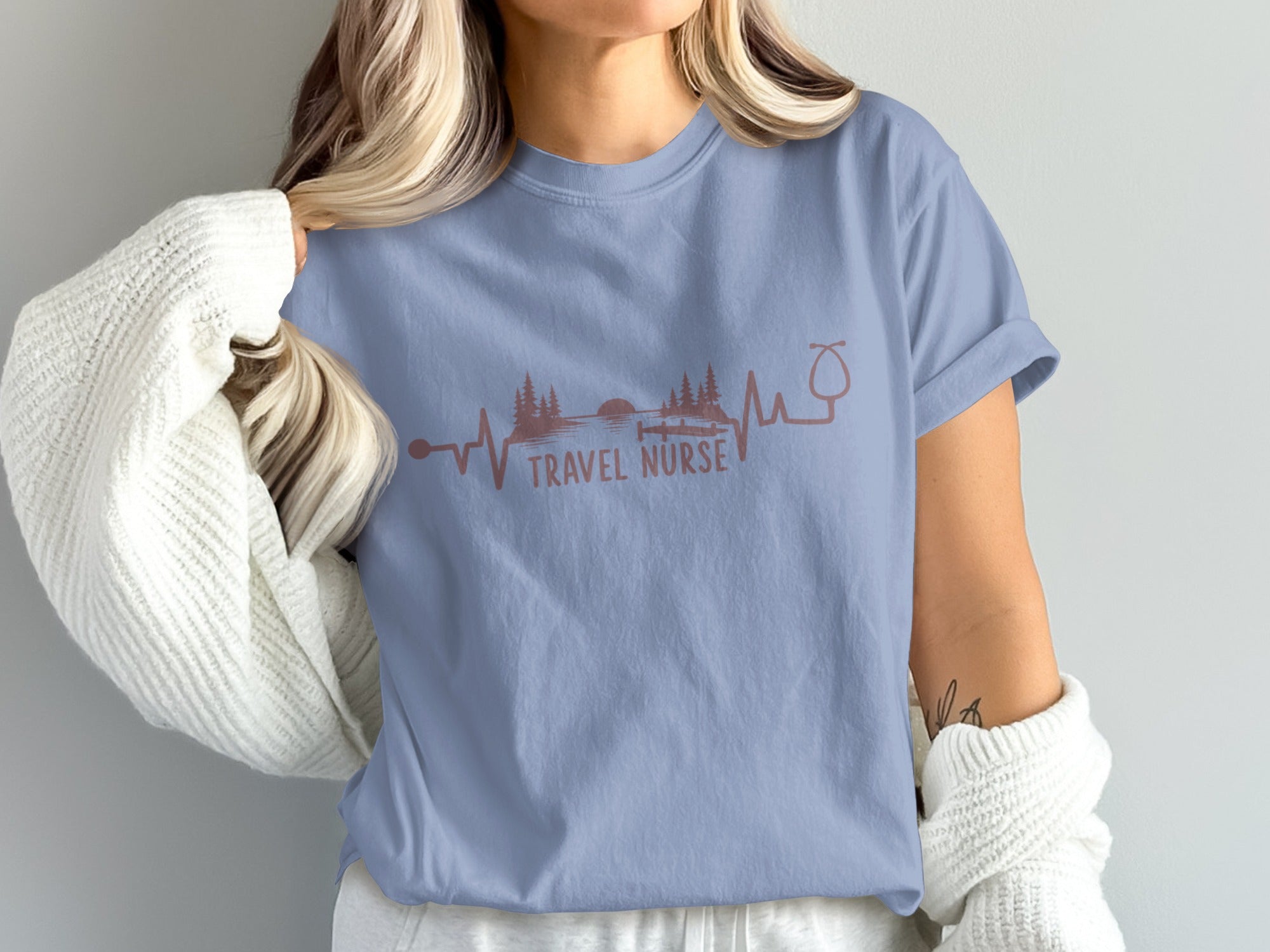 T-shirt with "TRAVEL NURSE" text, heartbeat, stethoscope, and nature graphic.